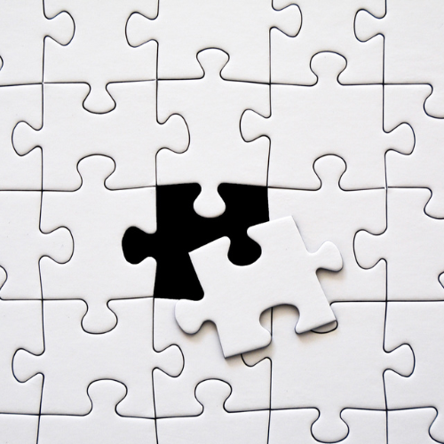 Puzzel met goud stukje